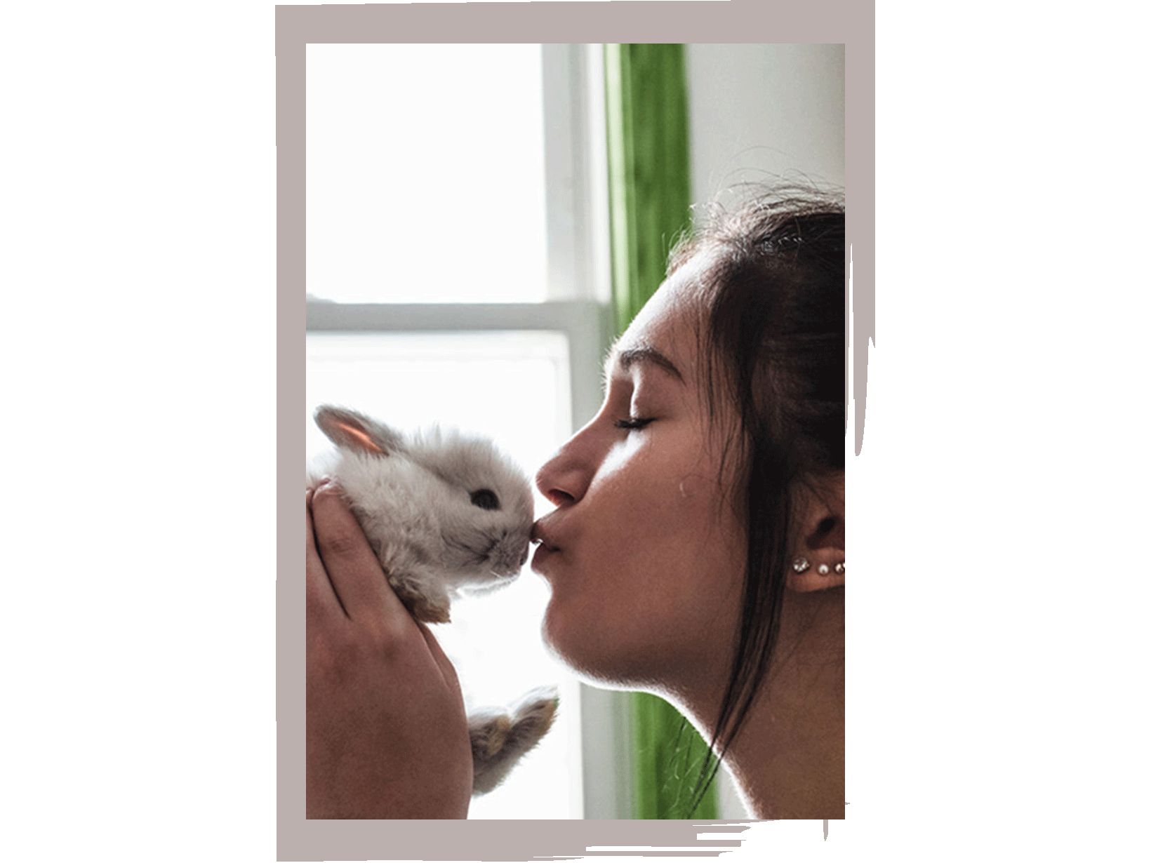 woman-kissing-bunny